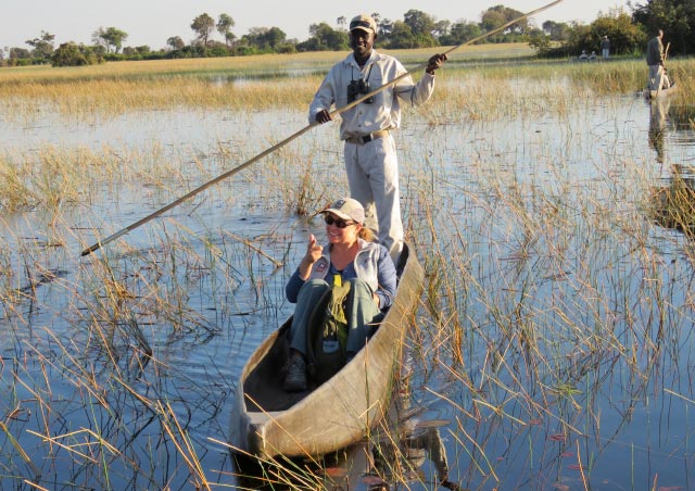 Traveling by mokoro with my local guide, “G”, in the Okavango Delta, Botswana.