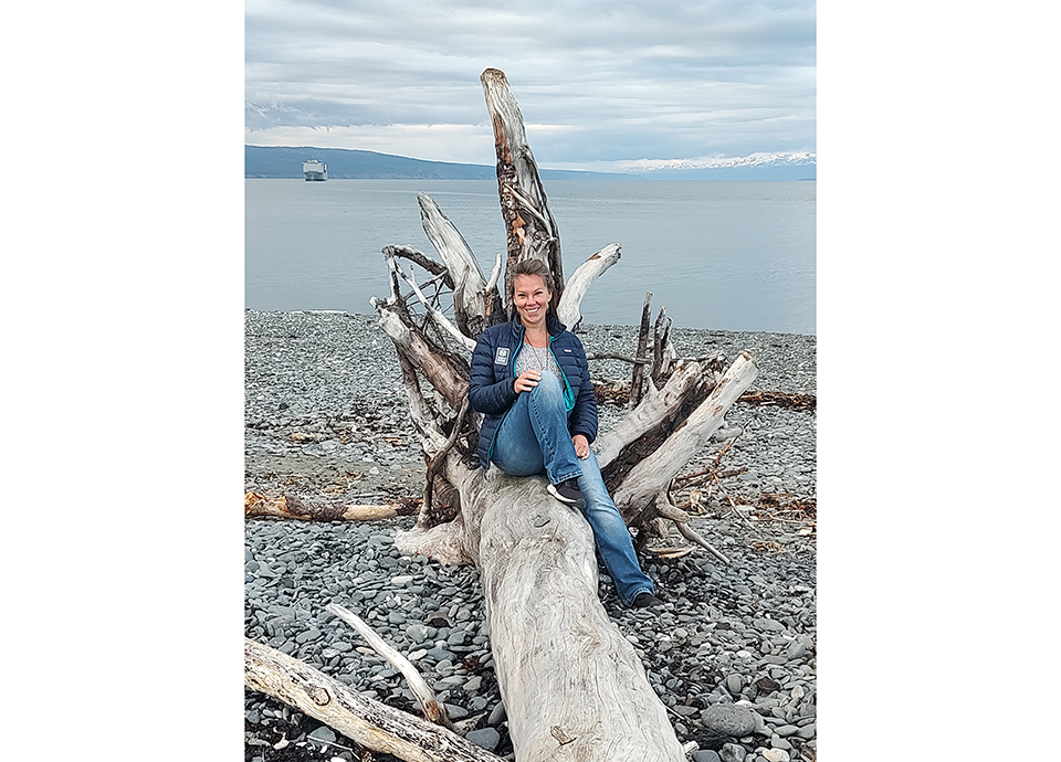 Corrin enjoying combing the beach at Land’s End Resort in Homer, Alaska at the start of her Alaska Bear Camp Adventure.