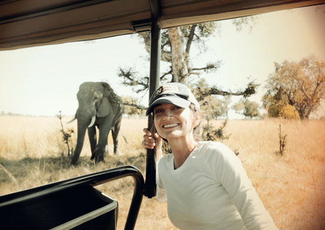 In the Okavango Delta, Botswana, with a curious elephant.