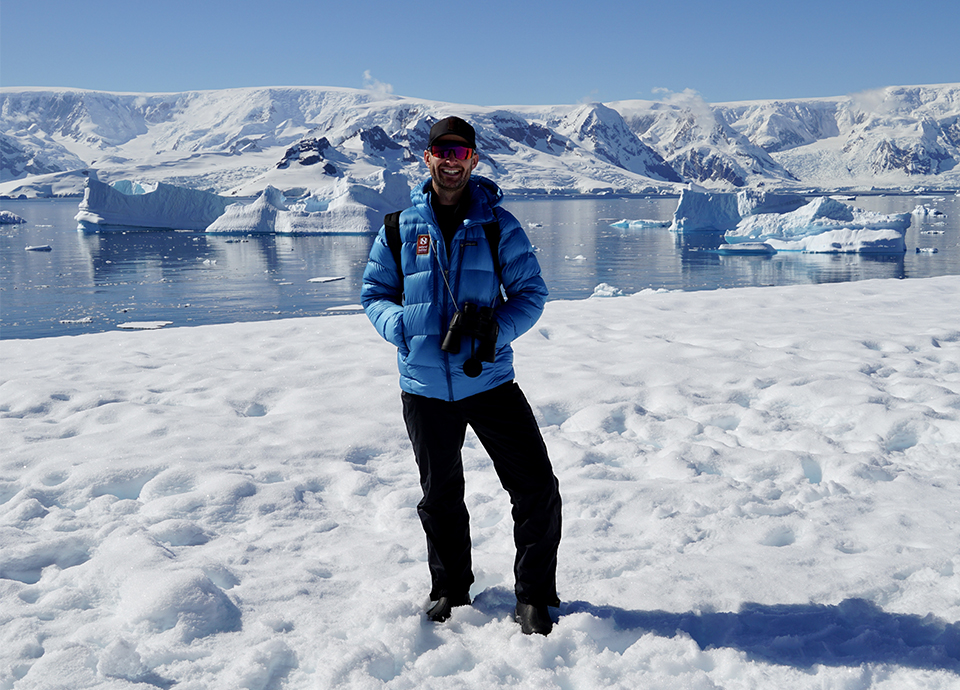 Smiling in the sun on a bluebird day in Antarctica at Portal Point in January 2023.