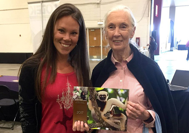 Corrin and Dr. Jane Goodall pose with one of Corrin's conservation products—The Primate Connections calendar—endorsed by Dr Goodall herself.
