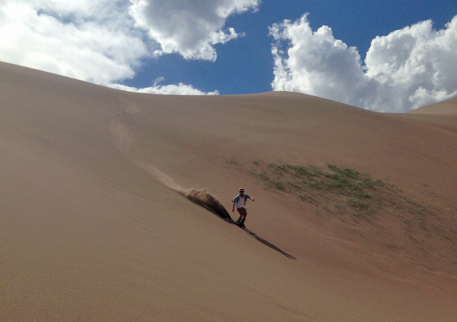 Skiing a sandy sand dune in Great Sand Dunes National Park out of Alamosa, Colorado. Not as fun as snow, but a great summer alternative to my favorite thing.