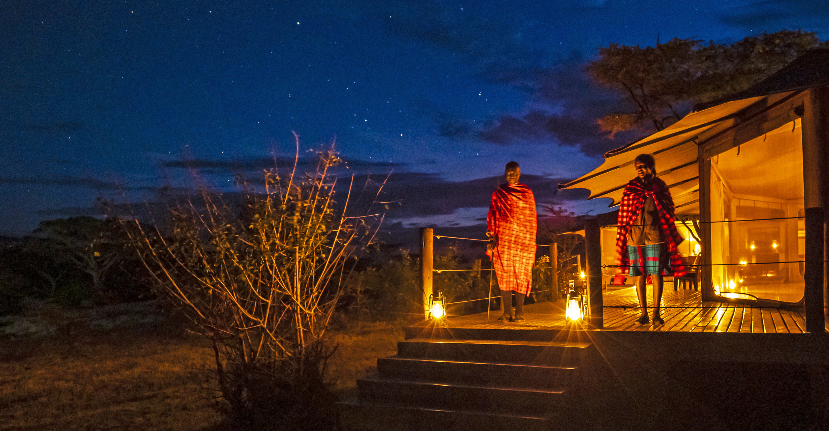 Two Maasai tribesmen at The Emakoko hotel in the evening, Kenya