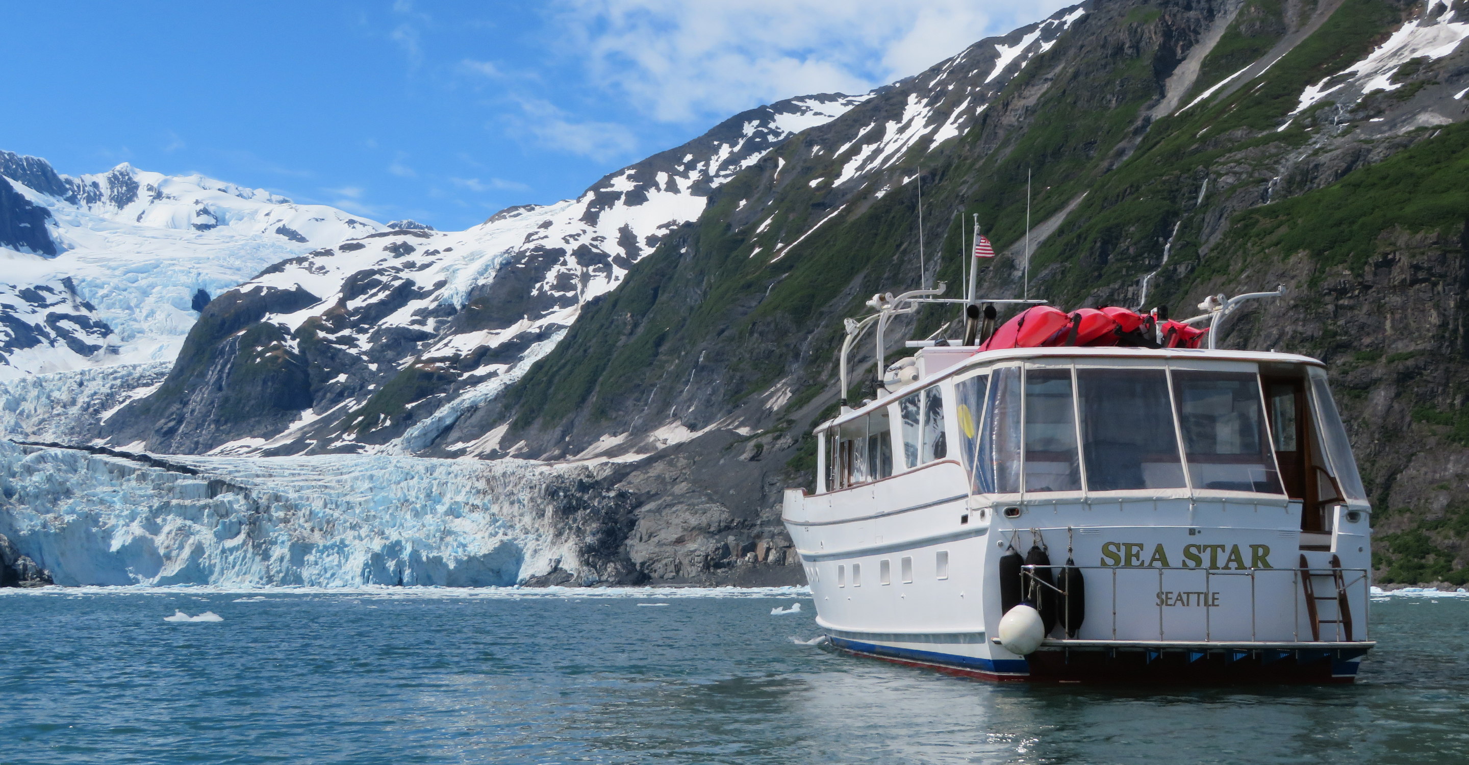 The Sea Star yacht cruises toward a glacier in Prince William Sound, Alaska, USA