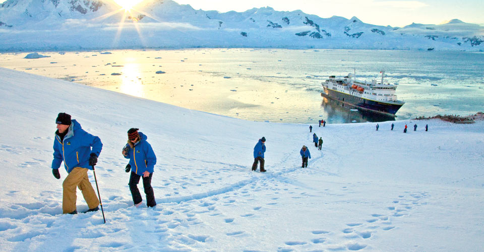 Lindblad Expeditions travelers disembark from the National Geographic Explorer in Neko Harbor, Antarctica