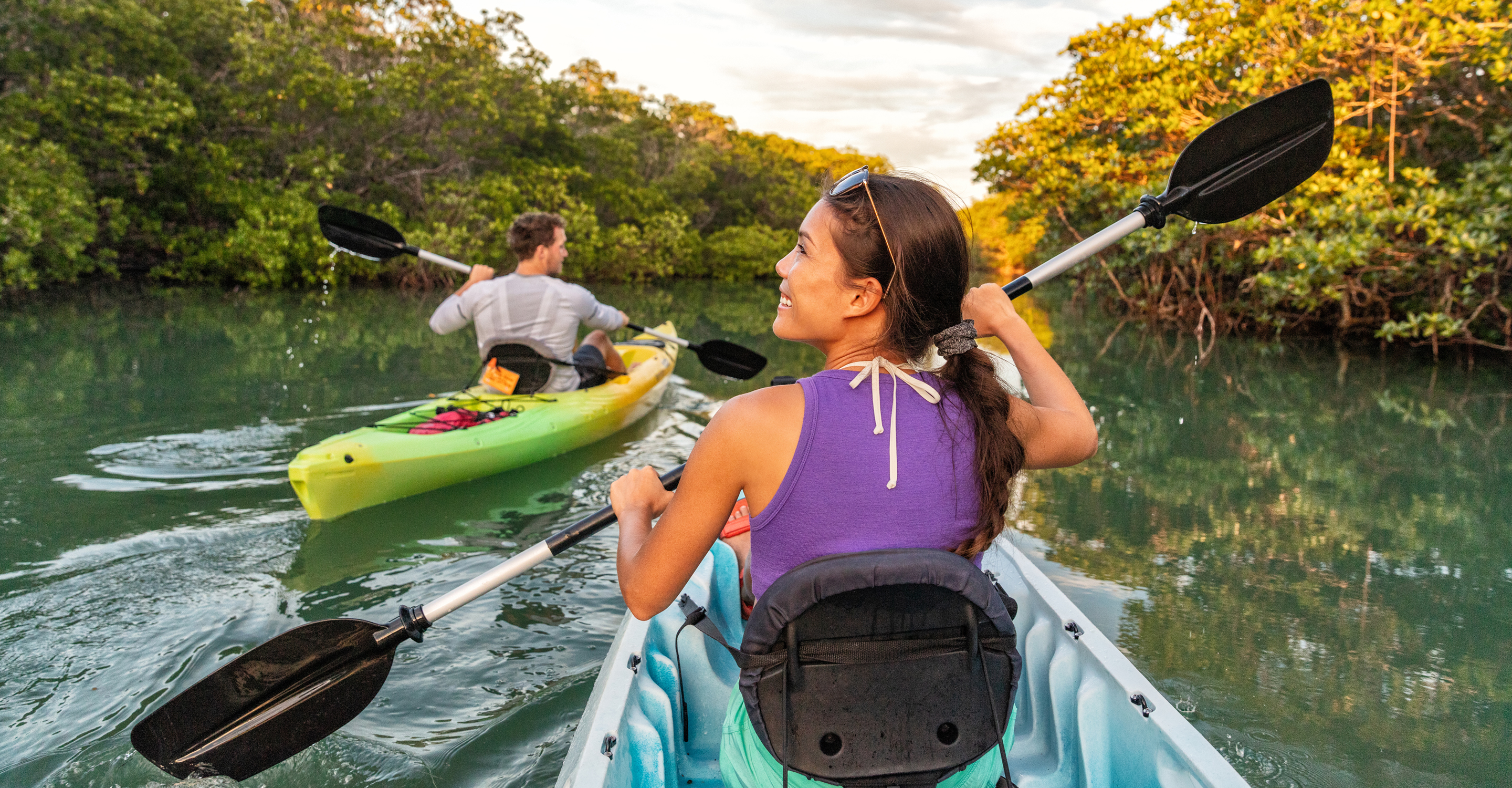 Happy people kayaking near Rookery Bay, Florida, United States