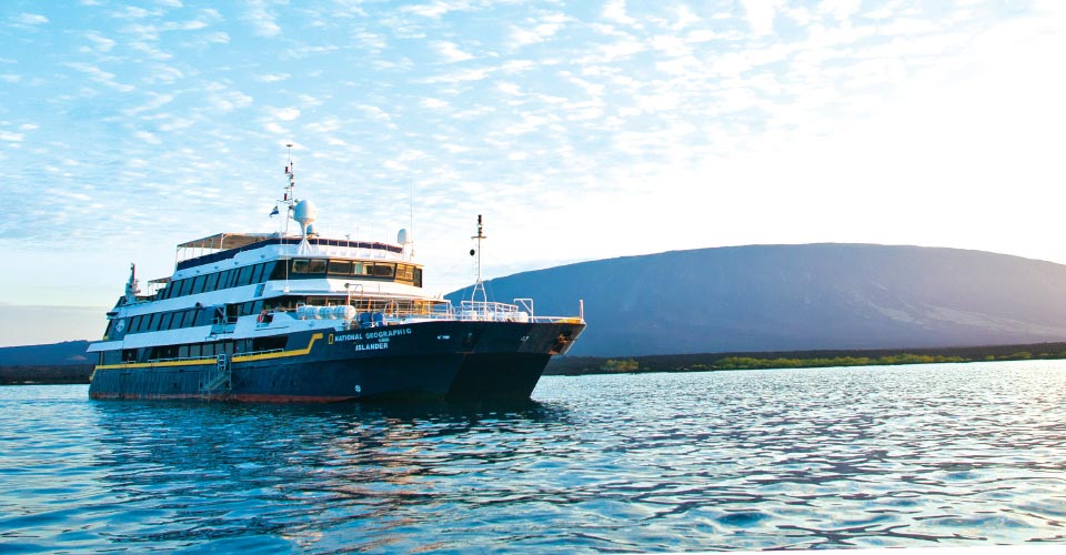 The National Geographic Islander ship cruises through the waters of the Galapagos Islands