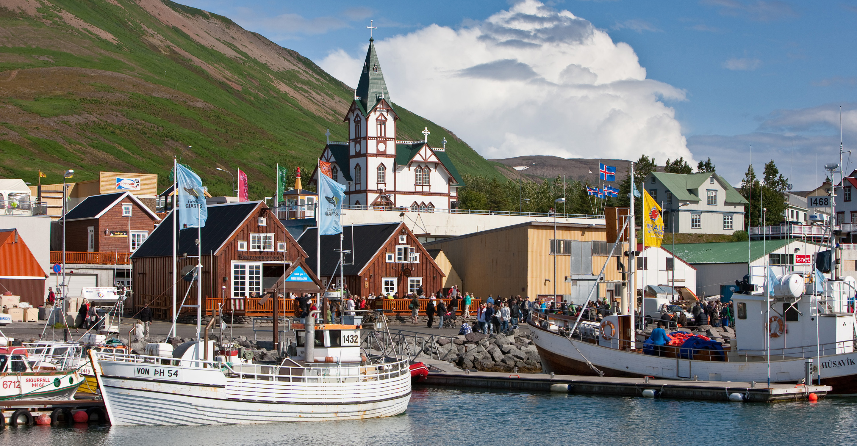 Bots sit in Husavík town harbor, Iceland, Europe