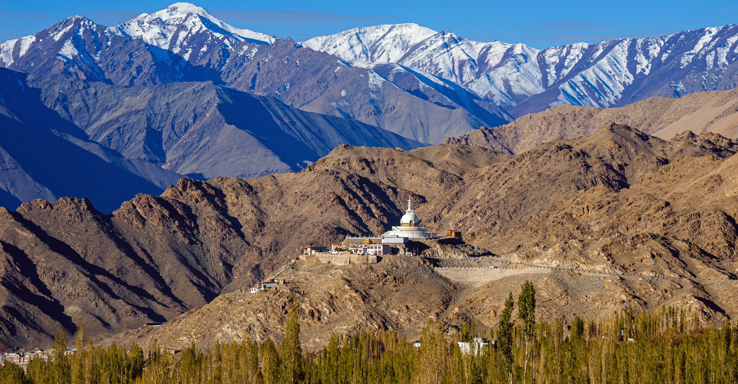 A stupa surrounded by the mountains in Ladakh, India