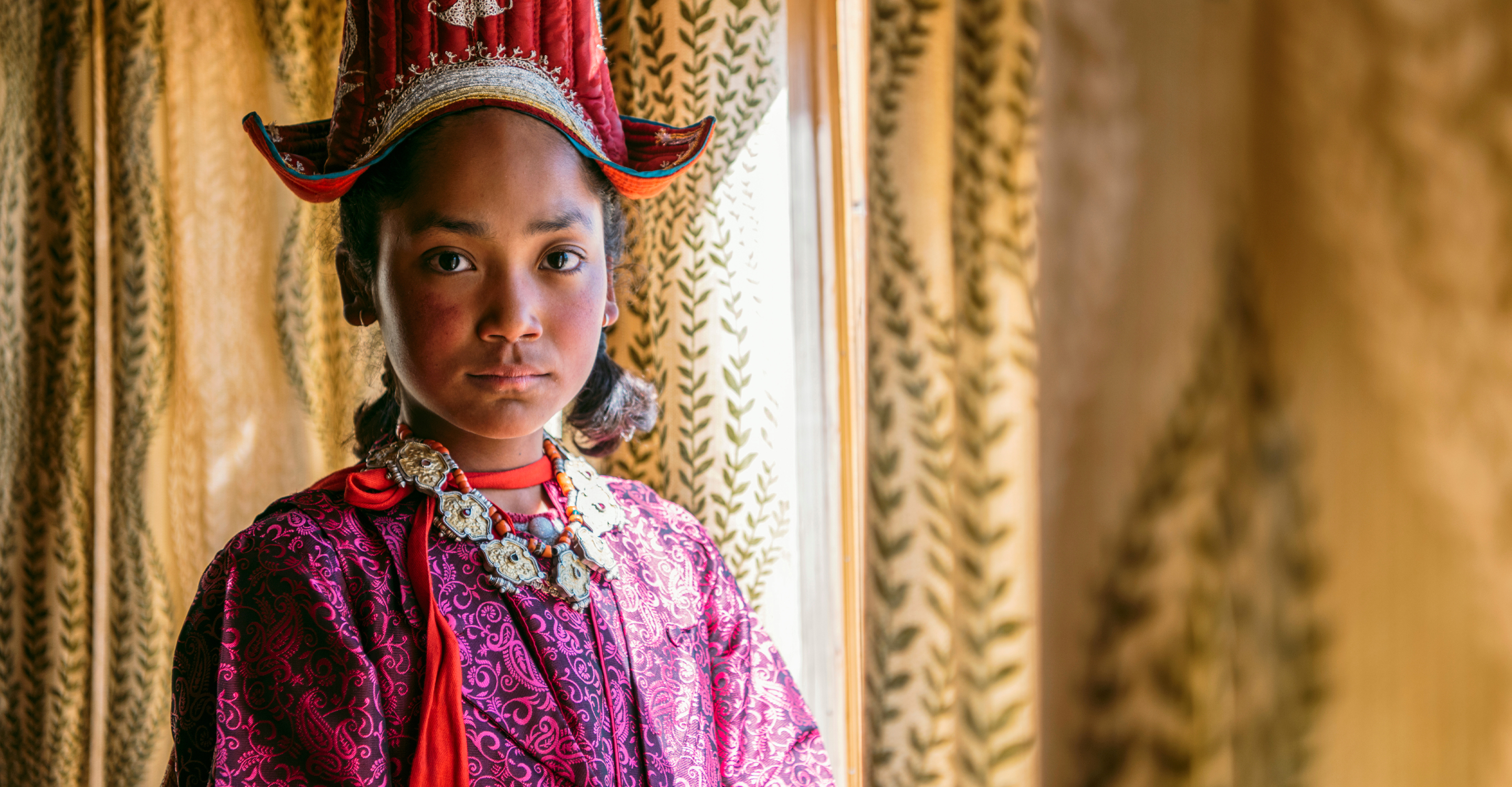 A young girl in traditional Tibetan clothing, Ladakh, India