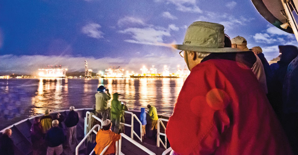 Travelers aboard the National Geographic Quest view the Panama Canal, Panama