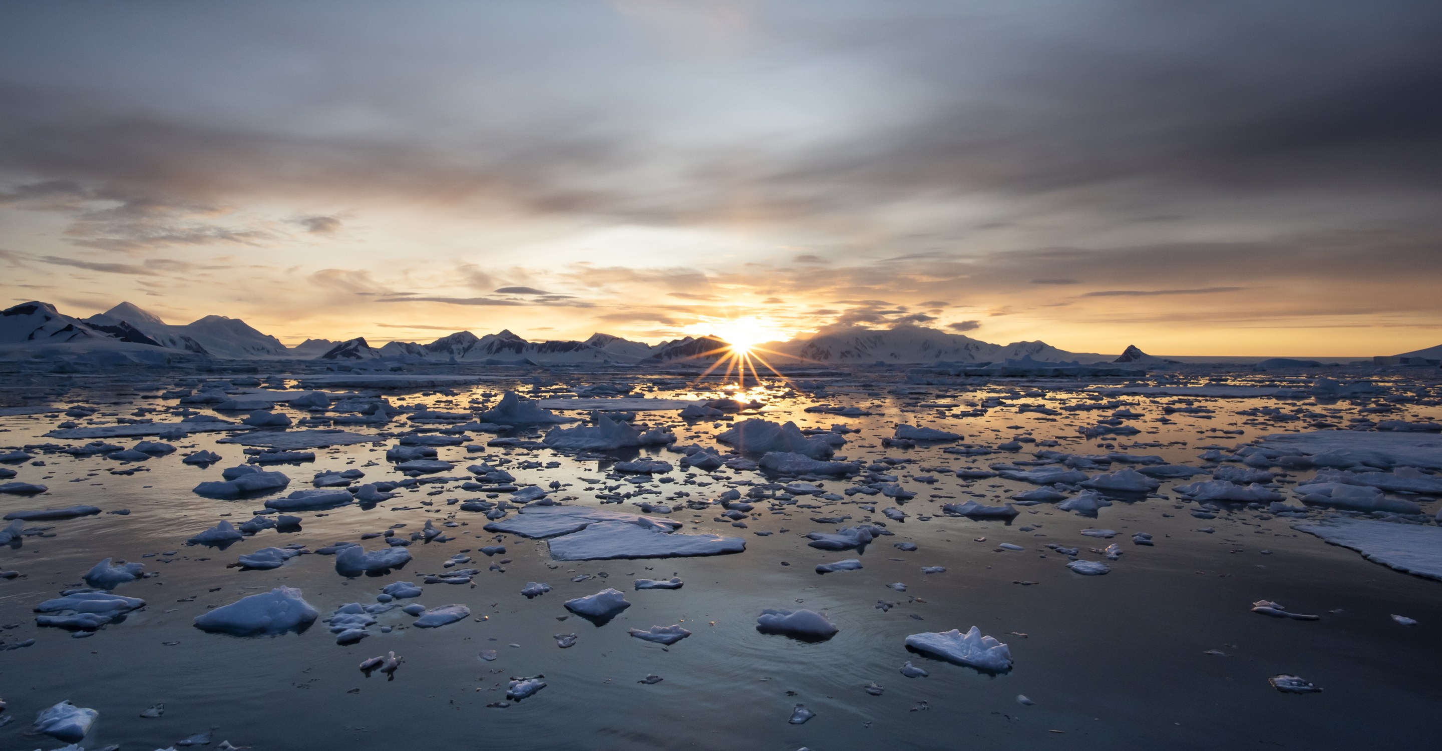 Sunset over the icy waters of Antarctica
