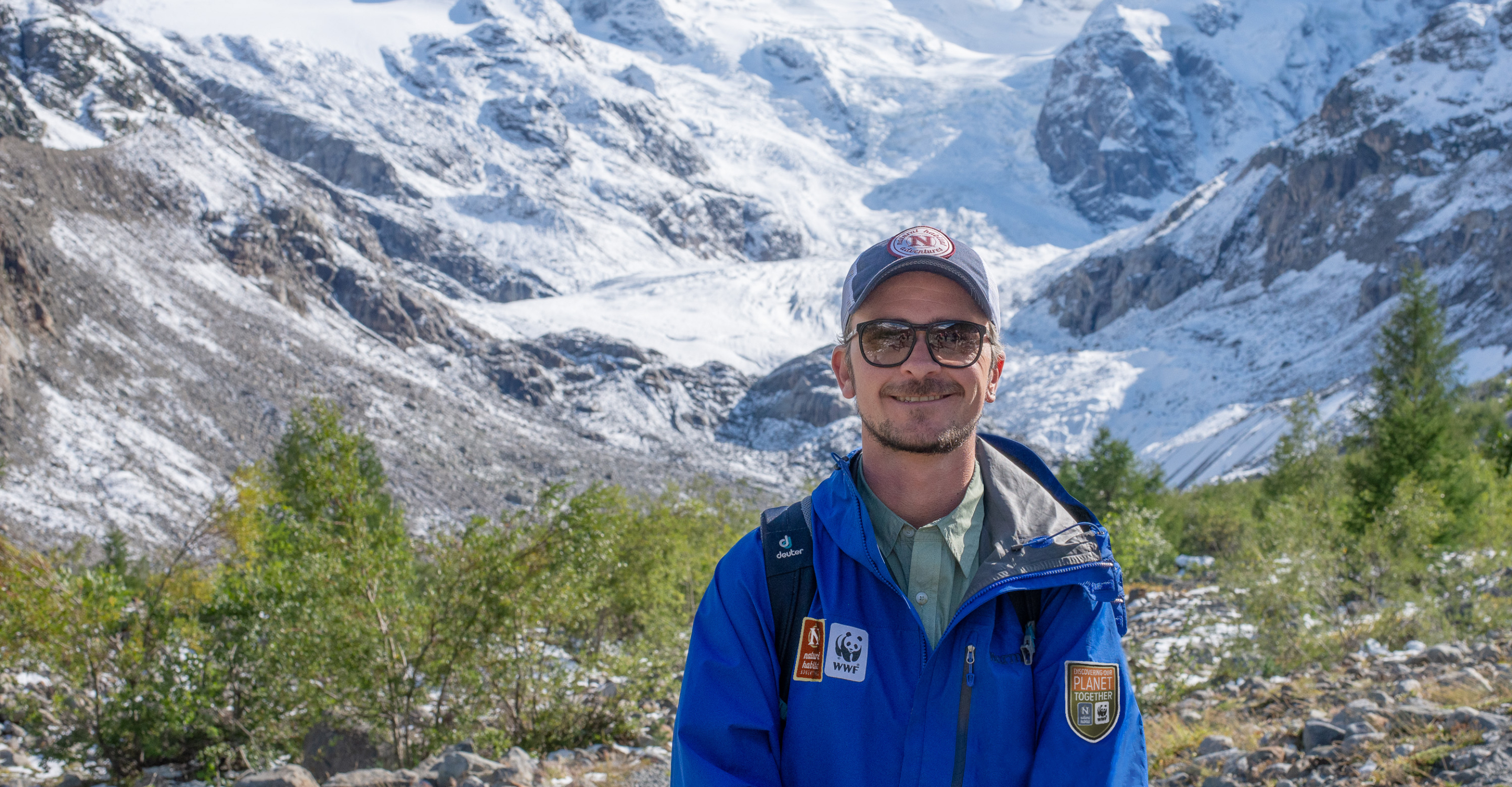A Natural Habitat Adventures guide smiles in front of Gorner Glacier, Switzerland
