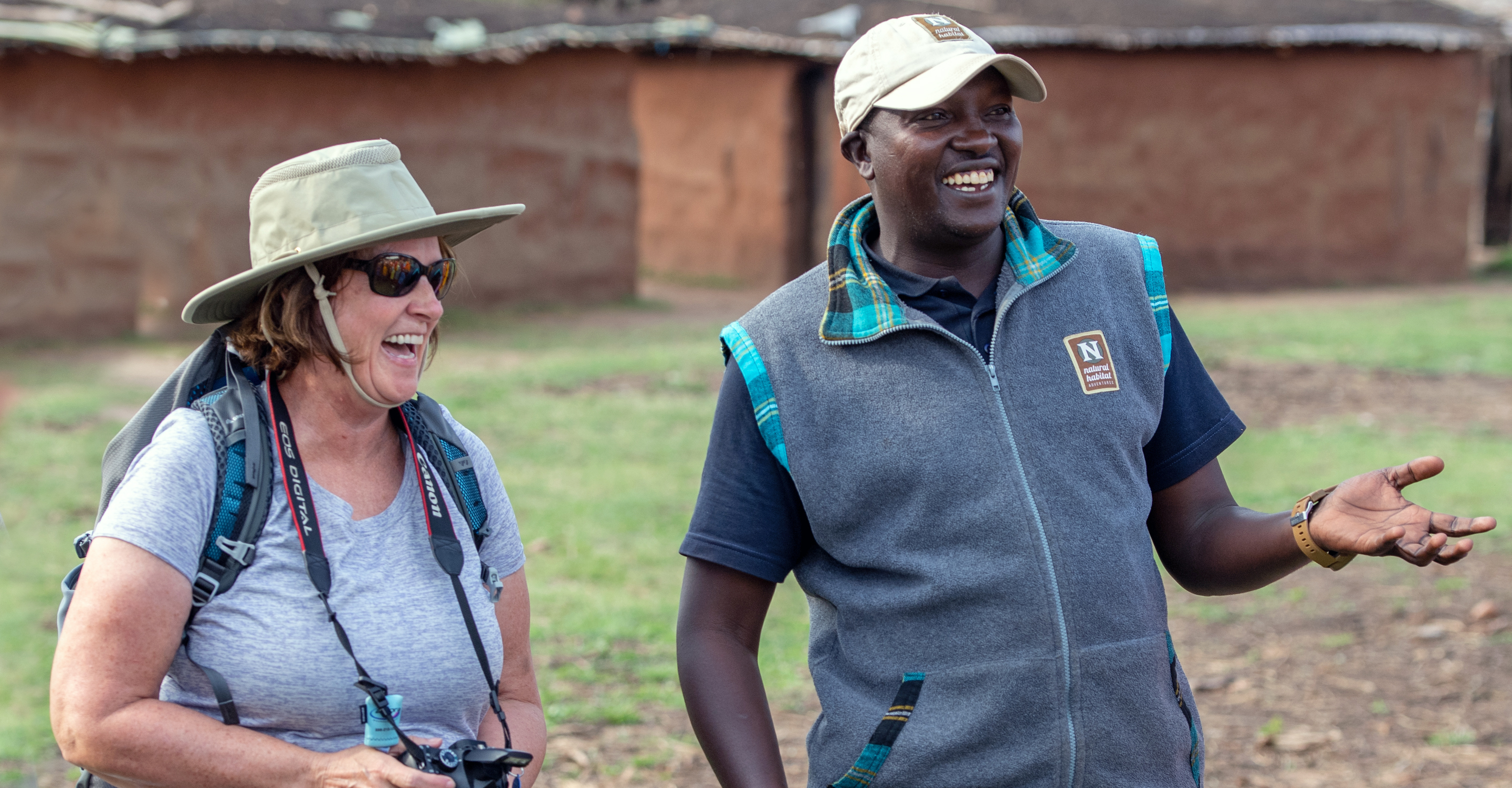 A Natural Habitat Adventures local guide and traveler share a laugh in Kenya